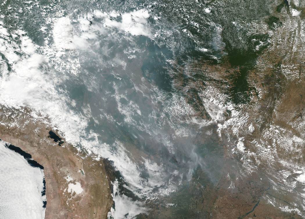 This satellite image provided by NASA shows the fires in Brazil on Aug. 20, 2019. As fires ra ...