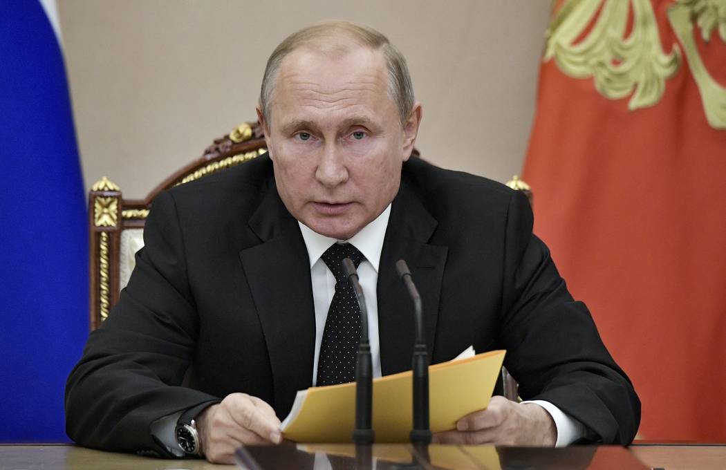 Russian President Vladimir Putin speaks at a meeting with members of the Security Council in th ...