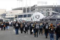 Fans tailgate outside of Oakland Alameda County Coliseum before an NFL football game between th ...