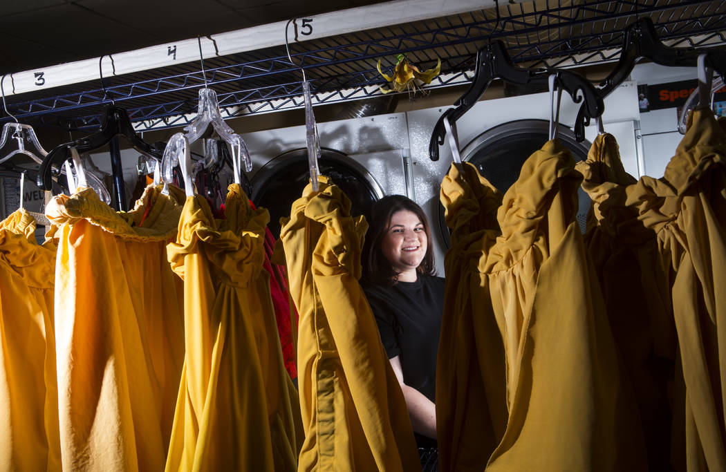 Tyler Cecchini, a crafts technician for Cirque du Soleil's "O," stands among costumes at the Be ...