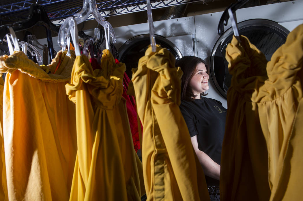 Tyler Cecchini, crafts technician at Cirque du Soleil's "O," stands among costumes at the Bella ...