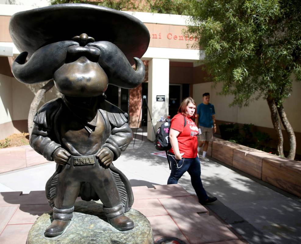 Students walk past a statue UNLV mascot Hey Reb! on campus Friday, Aug. 23, 2019. (K.M. Cannon/ ...