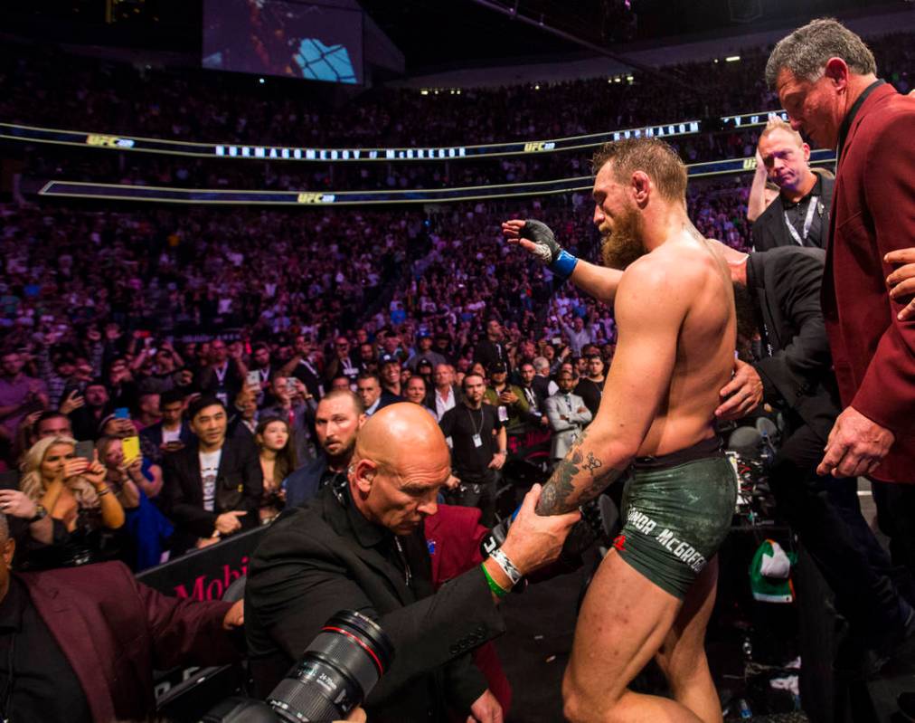 Conor McGregor leaves the octagon after his loss to Khabib Nurmagomedov in their lightweight ti ...