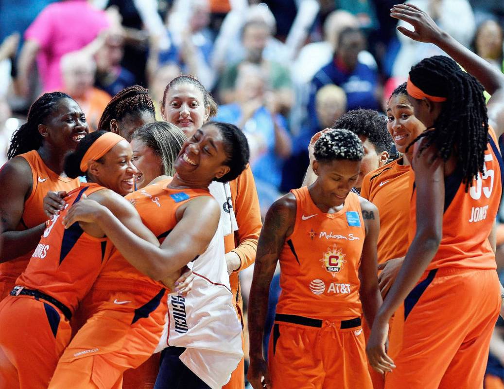 Connecticut Sun players celebrate a win over the Las Vegas Aces in a WNBA basketball game Frida ...