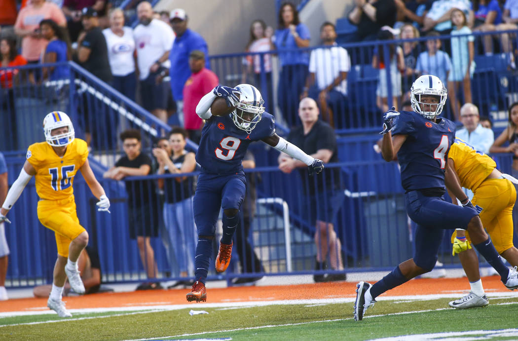 Bishop Gorman's Zachariah Branch (9) makes his way to the end zone to score a touchdown against ...