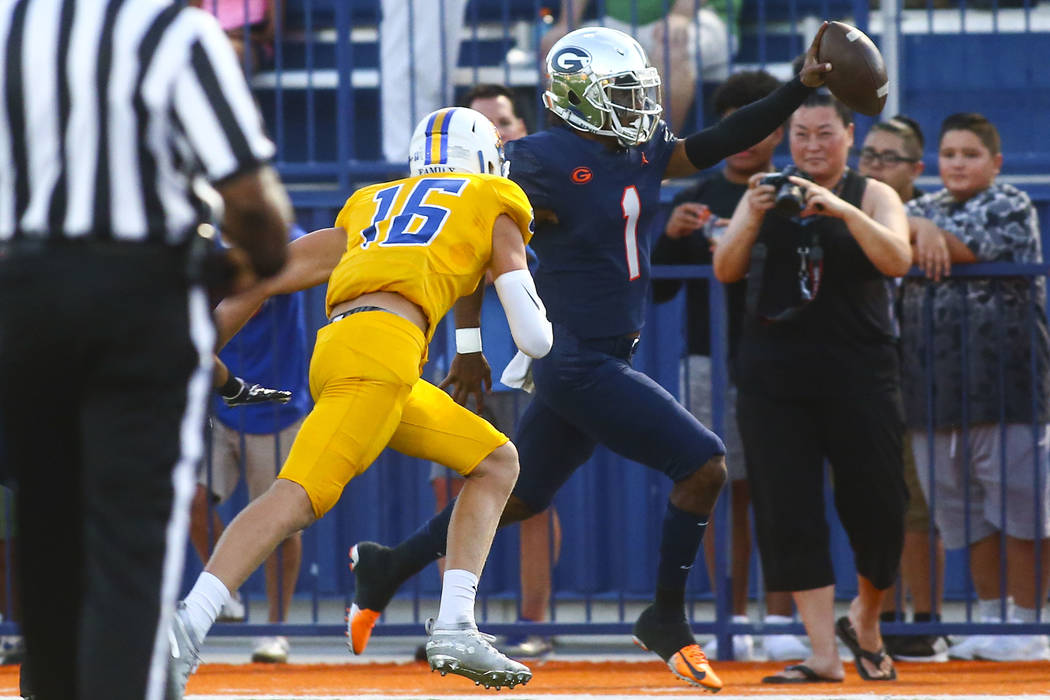 Bishop Gorman's Micah Bowens (1) is forced out of bounds by Orem's Brody Monson (16) near the e ...