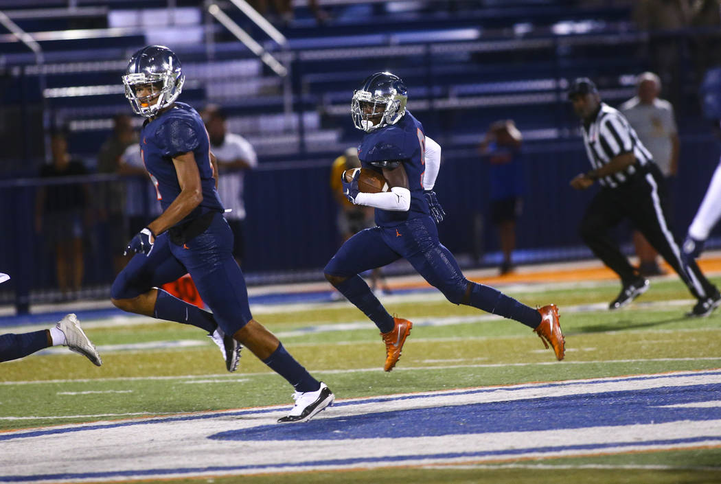 Bishop Gorman's Zachariah Branch (9) runs the ball against Orem during the first half of a foot ...