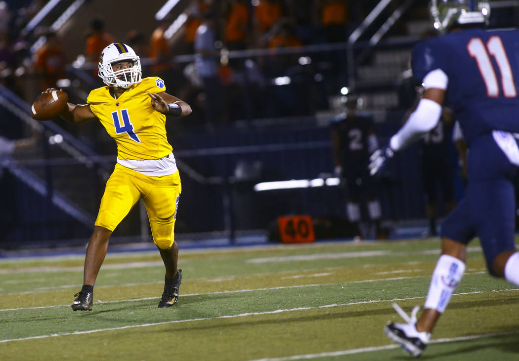 Orem's Kana'ipono Kahala-Giron (4) looks to pass during the second half of a football game at B ...