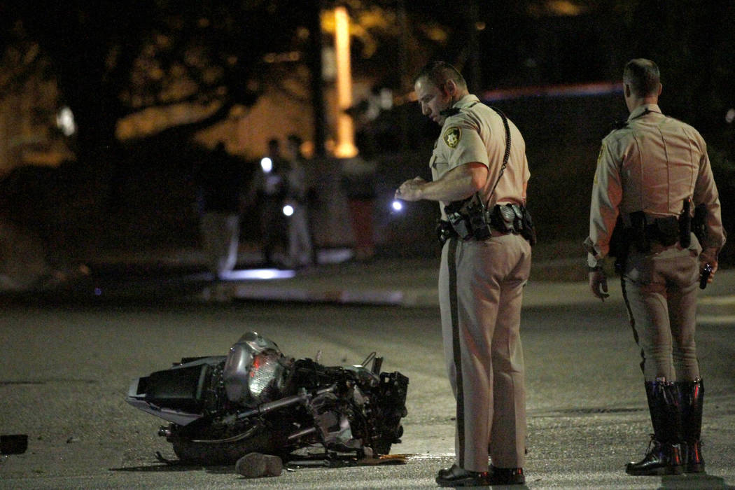 Las Vegas police officers investigate a fatal motorcycle accident at Martin Luther King Bouleva ...