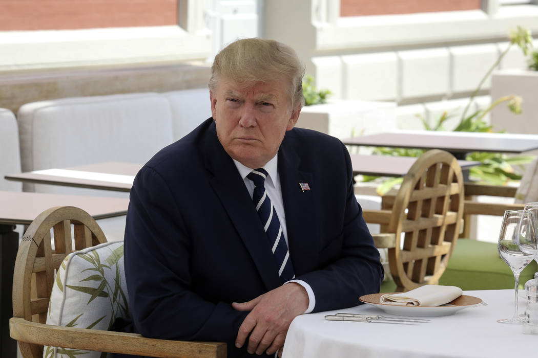 U.S President Donald Trump atttends a lunch with French President Emmanuel Macron in Biarritz, ...