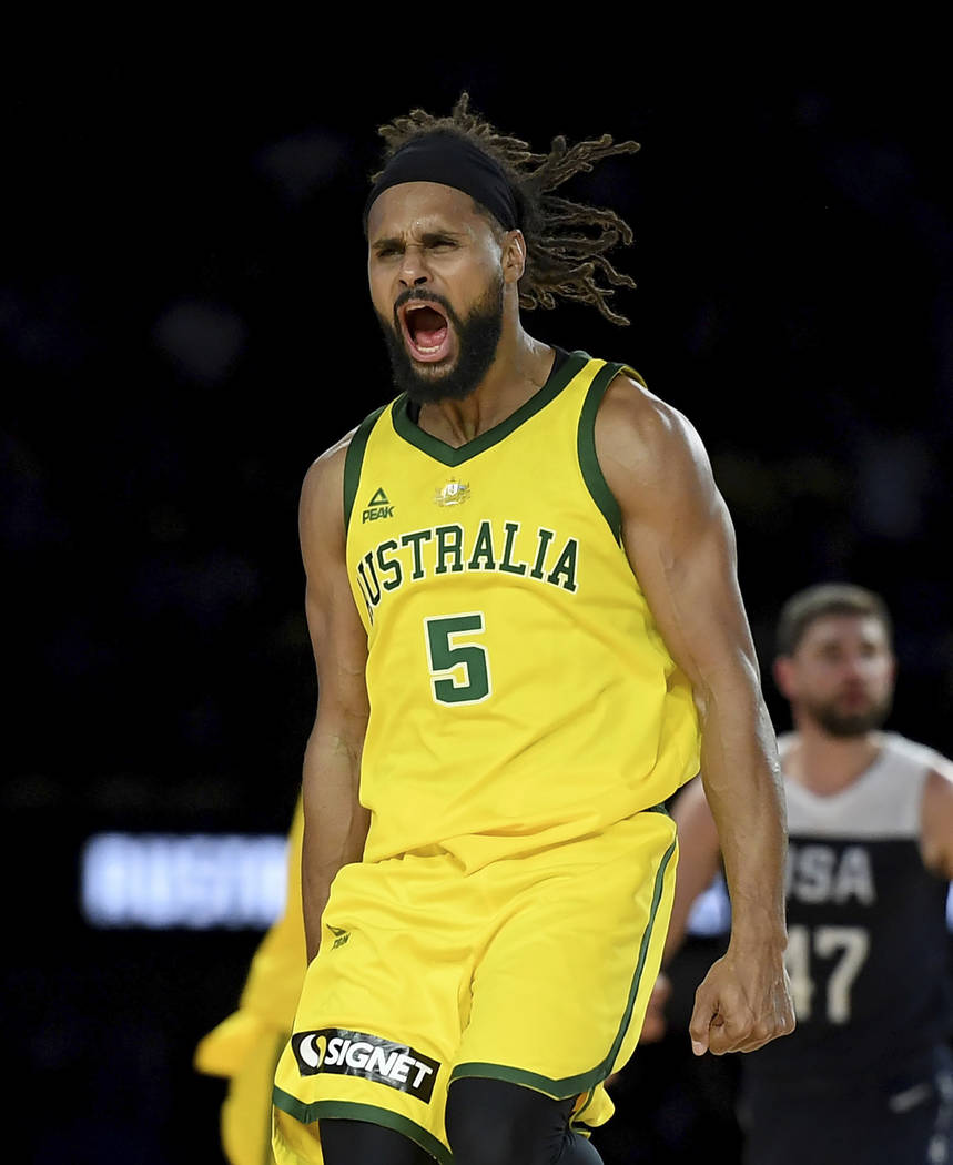 Australia's Patty Mills celebrates after shooting a 3-pointer during their exhibition basketbal ...