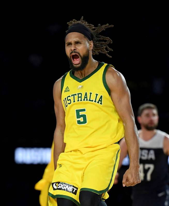 Australia's Patty Mills celebrates after shooting a 3-pointer during their exhibition basketbal ...