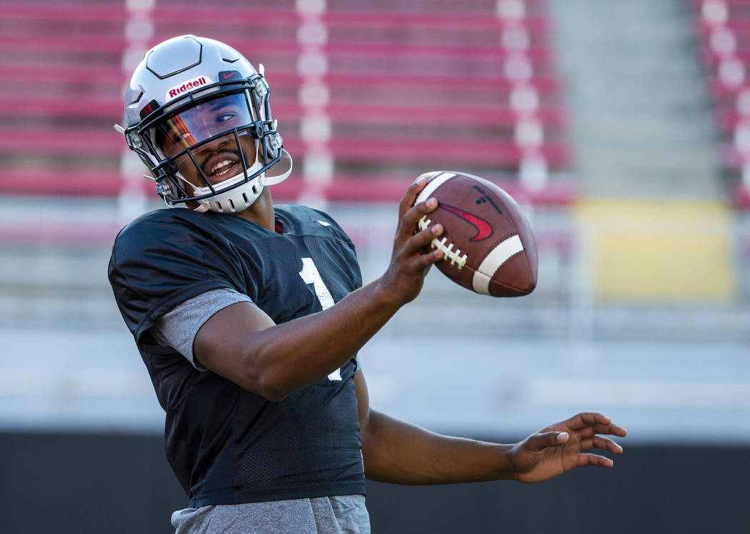 UNLV QB Armani Rogers (1) looks to make a a toss to his running back during their first major s ...