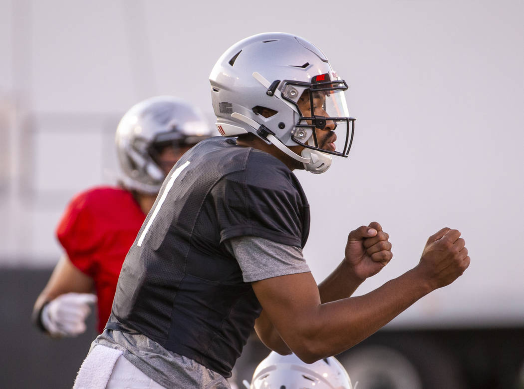 UNLV QB Armani Rogers (1) calls a play during their first major scrimmage of football training ...