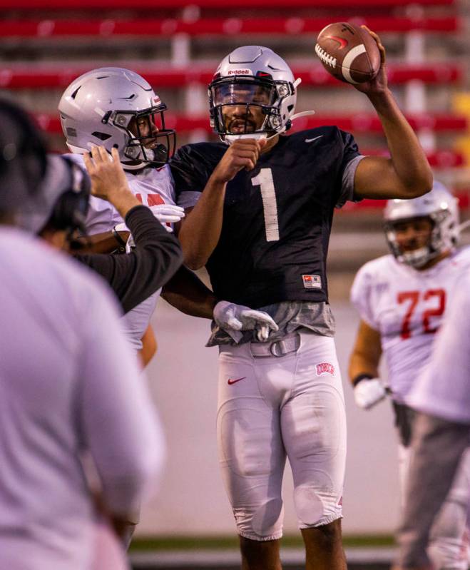 UNLV QB Armani Rogers (1) celebrates a touchdown run with a teammate during their first major s ...