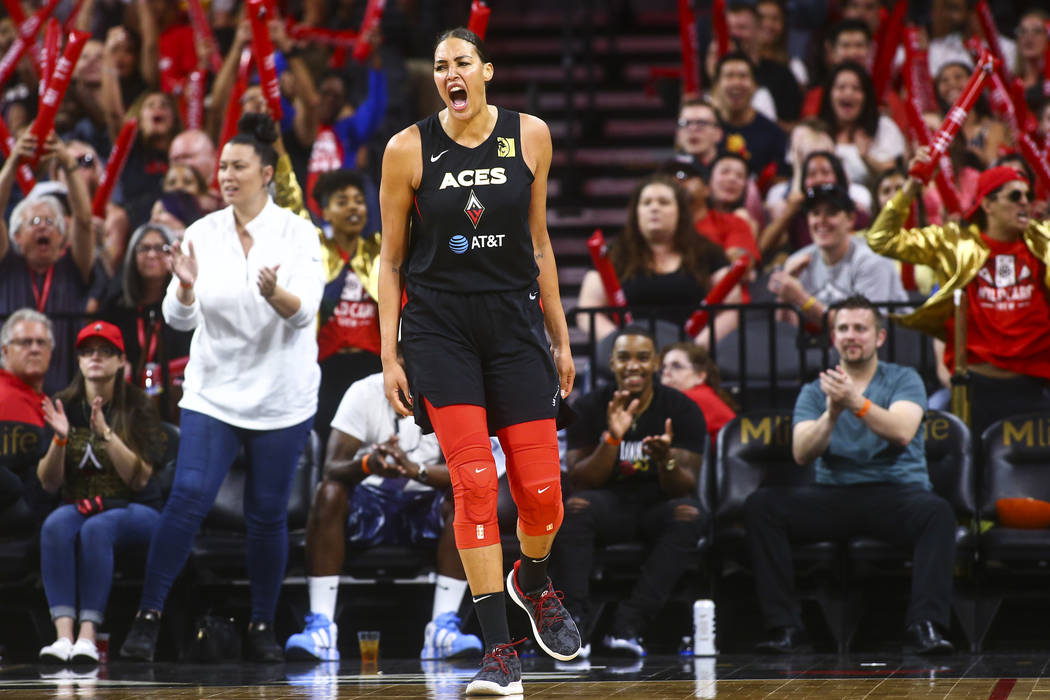 Las Vegas Aces' Liz Cambage celebrates during the second half of a WNBA basketball game against ...