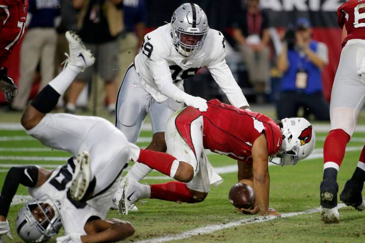 Arizona Cardinals quarterback Kyler Murray (1) is tackled in the end zone for a safety by by Oa ...