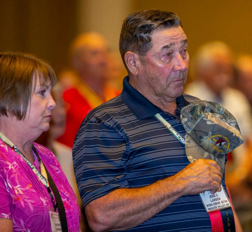 Veteran Jens Larsen, right, and his spouse Kerry stand during a benediction for those who serve ...