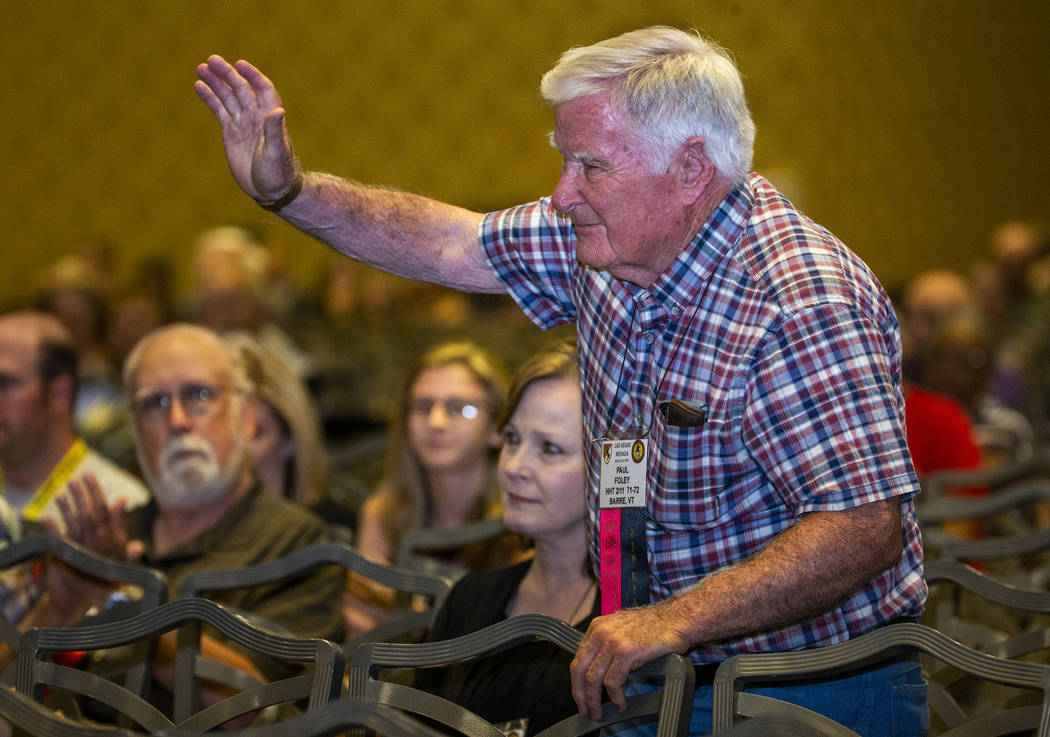 Trooper Paul Foley is recognized by other veterans and spouses who served in Vietnam during a r ...