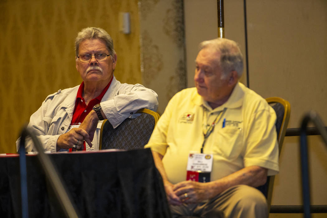 President Peter Walter and Pastor Bill Karabinos listen as a trooper reads to veterans and spou ...