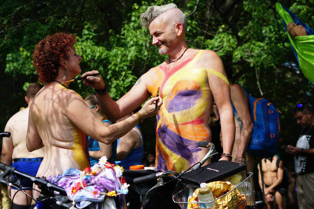 In this photo provided by David Cimetta, Melanie and Jim OâConnor paint each other's nude ...