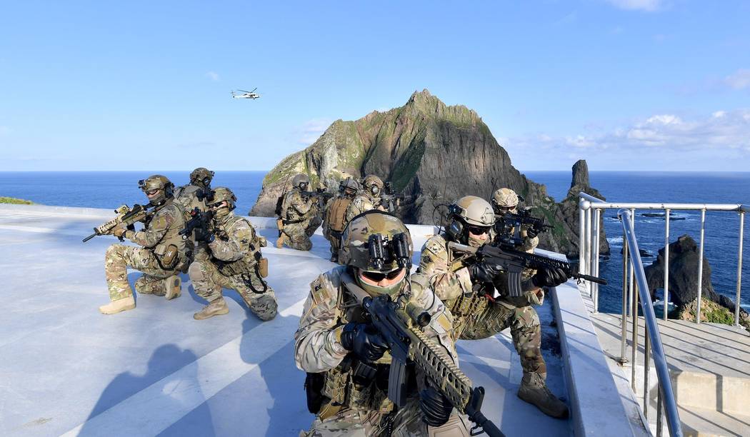 In this photo provided by South Korea's Navy, members of South Korean Navy's special forces par ...