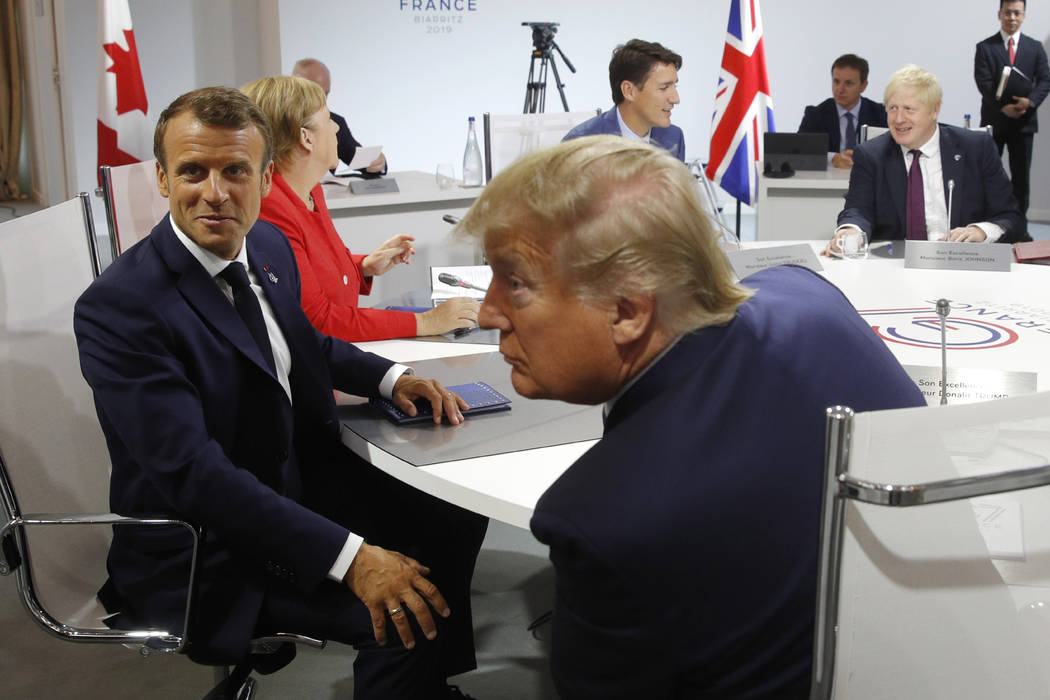 French President Emmanuel Macron, left, U.S. President Donald Trump with Britain's Prime Minist ...