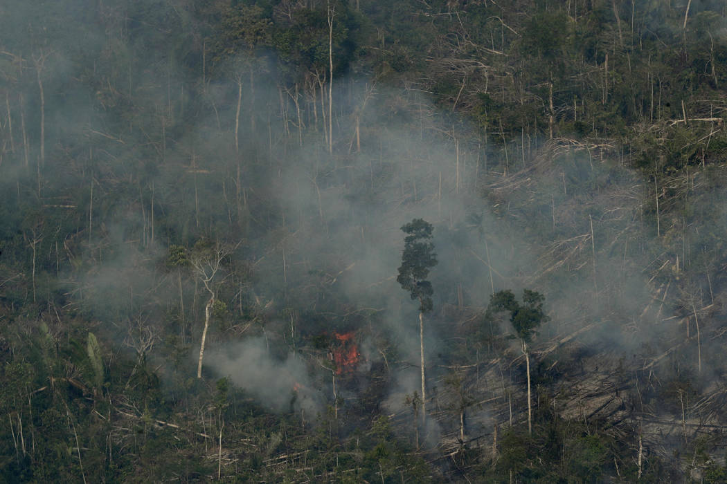 Fire consumes an area near Jaci Parana, state of Rondonia, Brazil, Saturday, Aug. 24, 2019. Bra ...