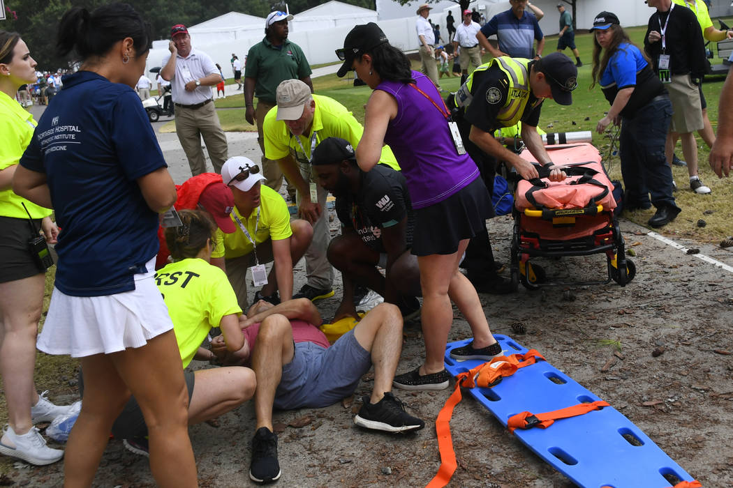 A spectator is tended to after a lightning strike left several injured during the third round o ...