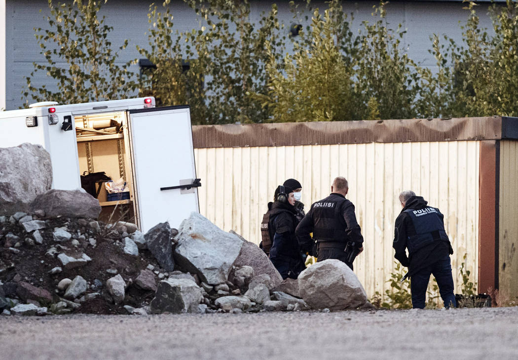 Police investigate an incident in an industrial area near Porvoo, Finland, early Sunday Aug. 25 ...