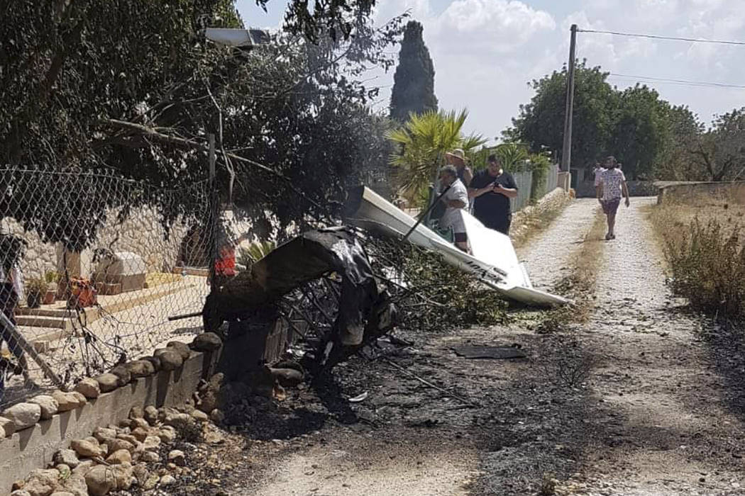 This photo provided by Incendios f.Baleares shows wreckage on a path near Inca in Palma de Mall ...