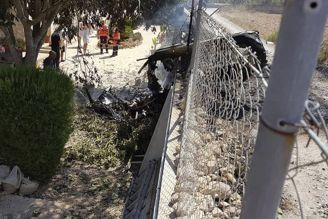 This photo provided by Incendios f.Baleares shows wreckage by a fence near Inca in Palma de Mal ...