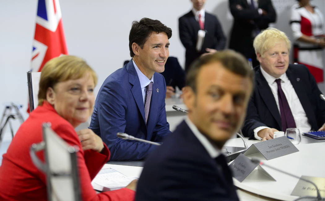 Canadian Prime Minister Justin Trudeau, second from left, German Chancellor Angela Merkel, left ...