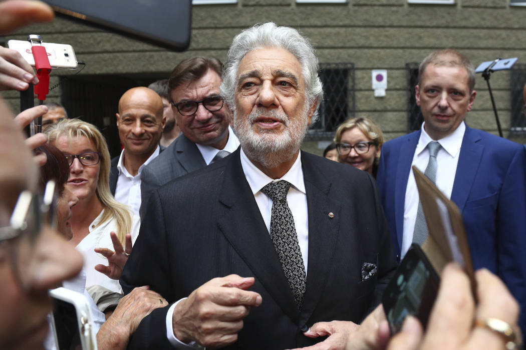 Placido Domingo talks to fans at the 'Festspielhaus' opera house after he performed 'Luisa Mill ...