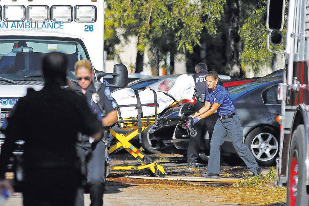 A woman is transported from The Rehabilitation Center at Hollywood Hills as patients are evacua ...