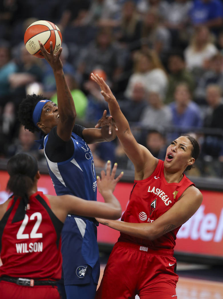 Minnesota Lynx center Sylvia Fowles (34) loses control of the ball after running into the defen ...