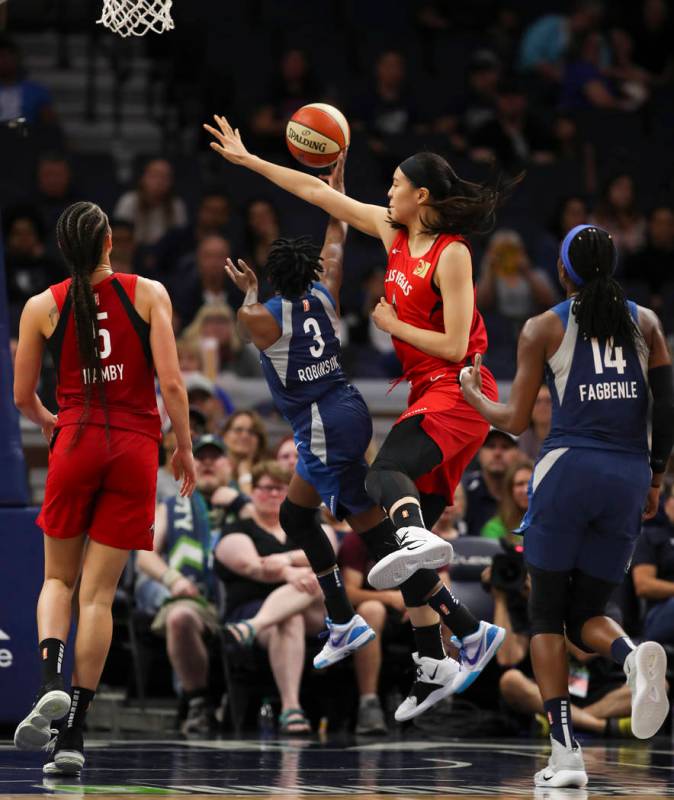 Minnesota Lynx guard Danielle Robinson (3) makes a shot as she is fouled by Las Vegas Aces cent ...