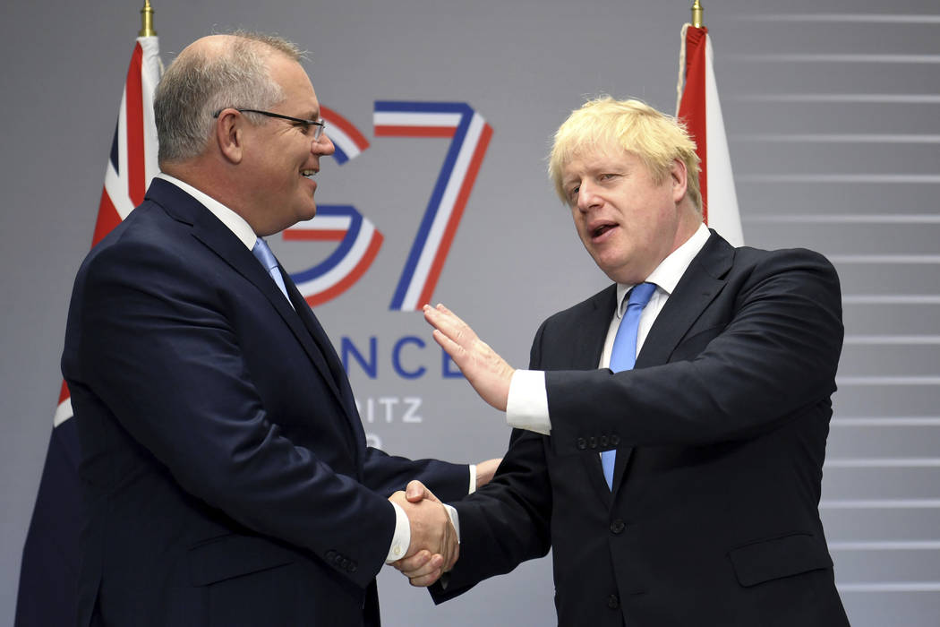 British Prime Minister Boris Johnson, right, meets Australian Prime Minister Scott Morrison for ...