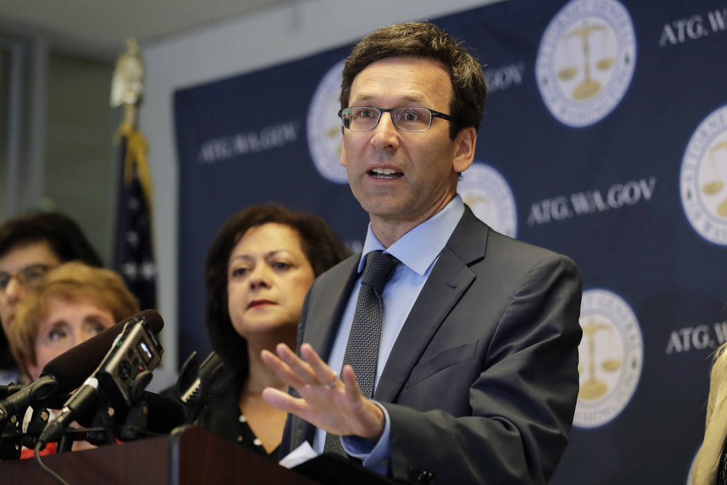 Washington Attorney General Bob Ferguson talks to reporters, Monday, Aug. 26, 2019, during a ne ...