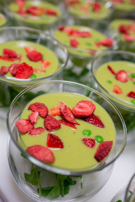 A chilled sweet pea, spinach and mint soup with basil-mint foam and strawberries for the recrea ...