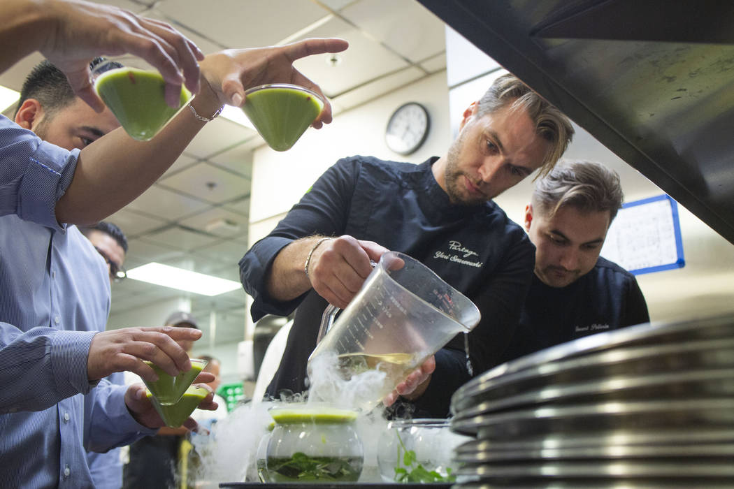 Chef Yuri Szarzewski of EATT Groumet Bistro, left, and chef Vincent Pellerin of Partage, prepar ...