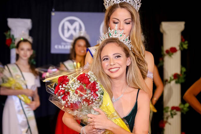 Kyndall Garza receives the crown for Miss World America - Nevada 2019 from Marisa Paige Butler, ...