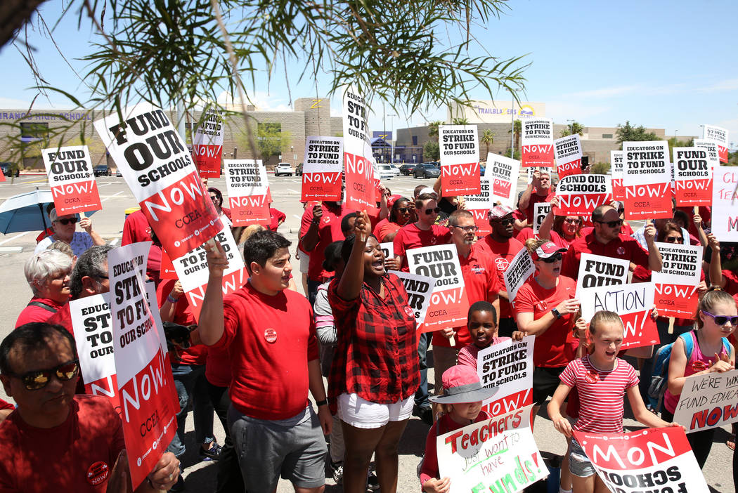 The Clark County Education Association members and their supporters gather during a rally in fr ...