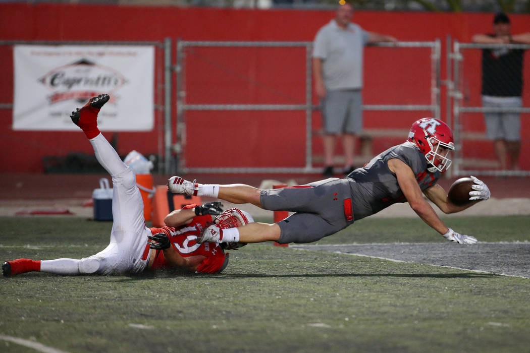 American Fork's Tanner Holden (11) dives for a touchdown against Arbor View's Nolan Weir (19) i ...