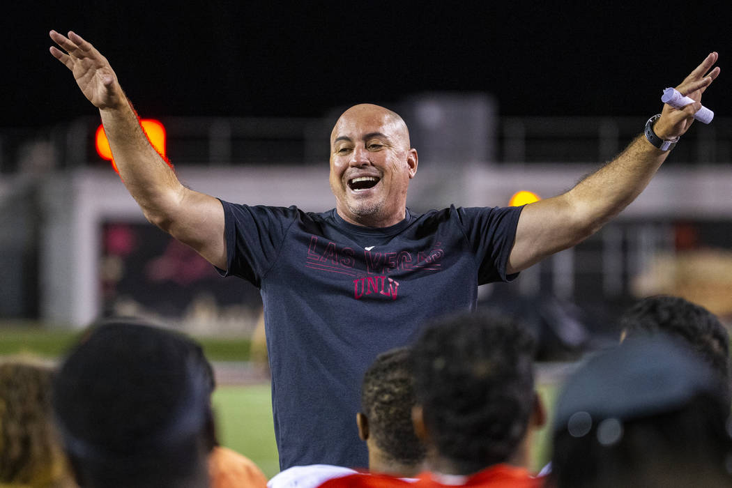 Head coach Tony Sanchez pumps up his players as the season nears following the UNLV football te ...