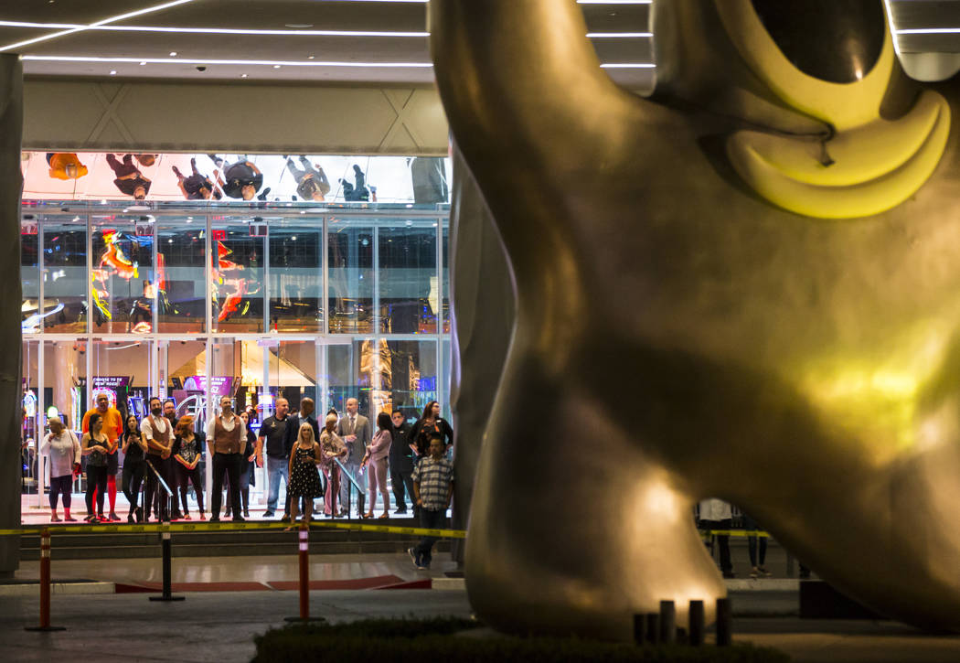 People watch before the "Sam by Starck" statue at the SLS Las Vegas is demolished ahe ...