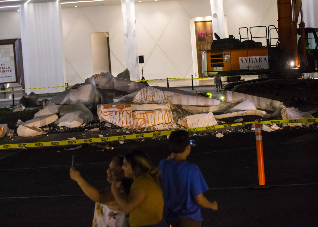 People record as the "Sam by Starck" statue at the SLS Las Vegas is demolished ahead ...