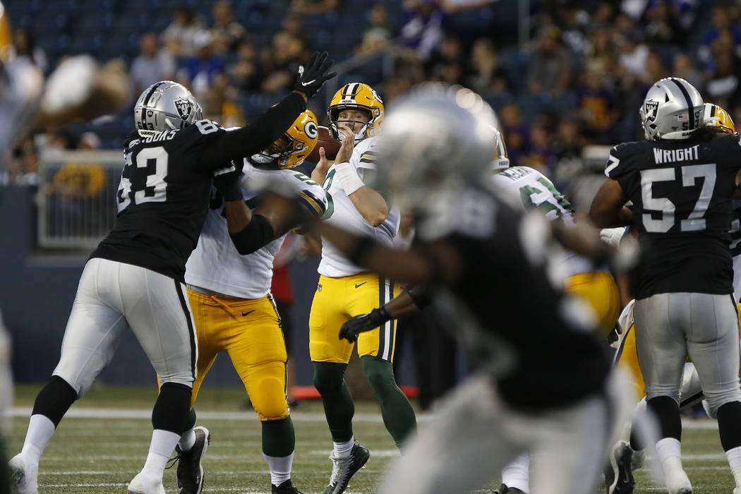 Green Bay Packers quarterback Tim Boyle (8) looks for a receiver during the first half of an NF ...