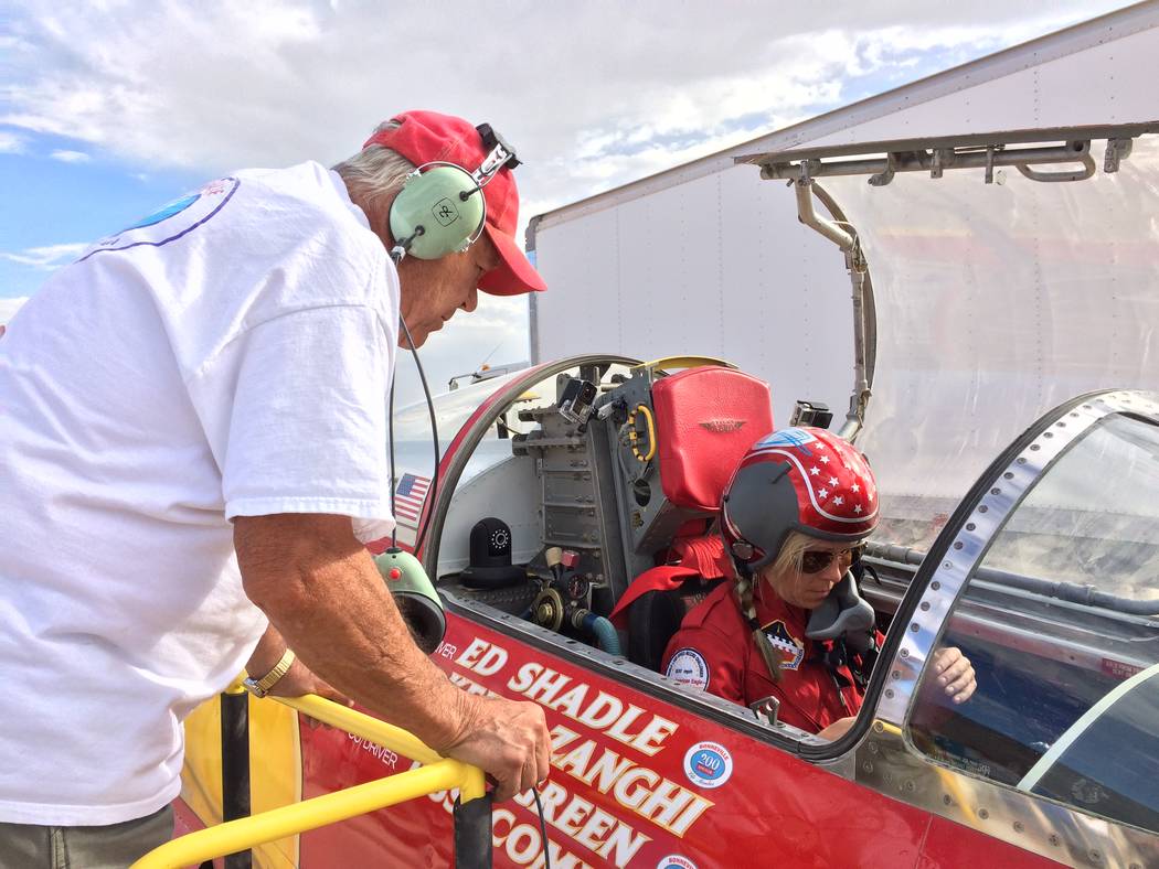 Ed Shadle looks on as driver Jessi Combs runs an engine test on the jet-powered car they hope t ...