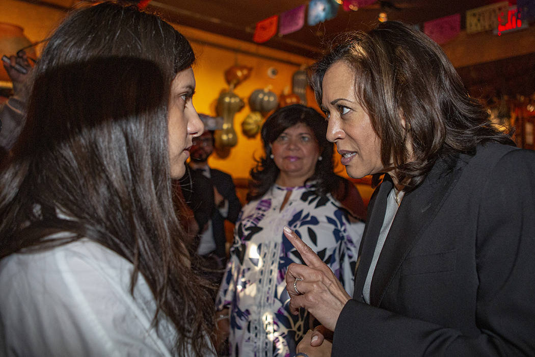 Democratic presidential candidate Sen. Kamala Harris, D-Calif., talks to Domenica Castro, 30, l ...